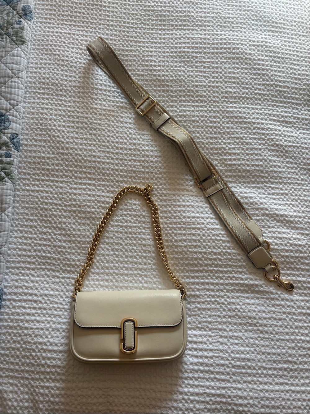 Marc Jacob’s “The J Marc” shoulder bag in ivory